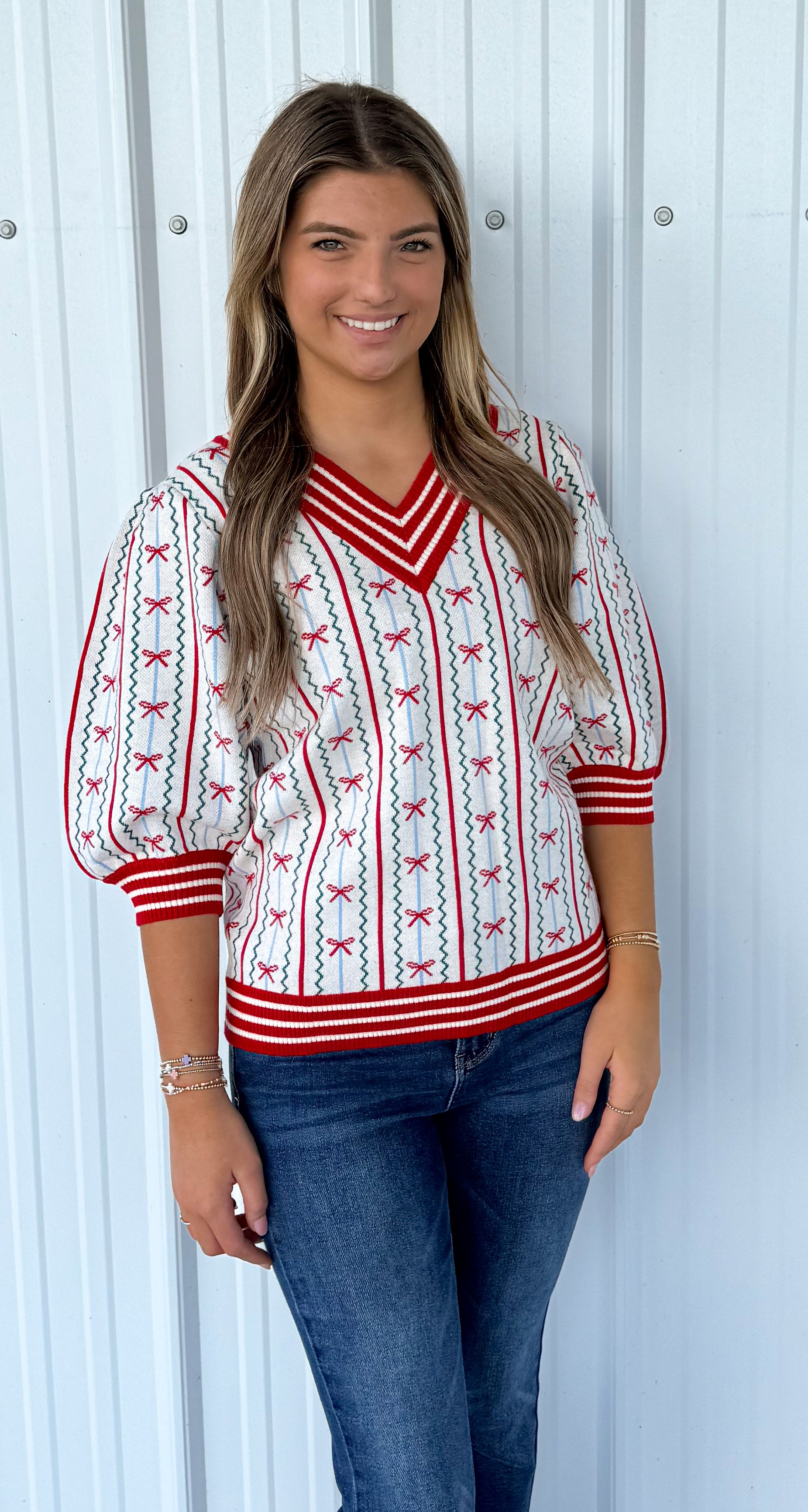 FAITH IN A BOW SWEATER